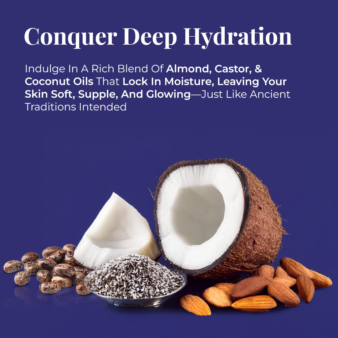 Set against a rich purple background, this image showcases natural ingredients of JiViSa Arabic Oudh Ayurvedic Soap including halved coconuts, almonds, castor beans, and coconut shavings in a bowl. The text reads: “Conquer Deep Hydration. Indulge in a rich blend of almond, castor, & coconut oils that lock in moisture, leaving your skin soft, supple, and glowing—just like ancient traditions intended.