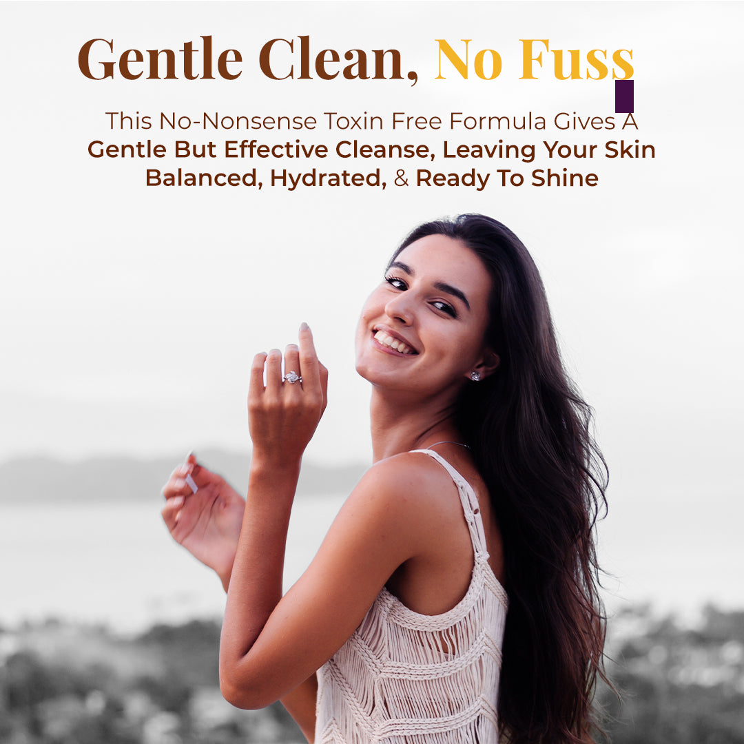 A young woman smiling broadly and looking over her shoulder with an outdoor, blurred background. Tagline: Gentle Clean, No Fuss. Text describes: This No-Nonsense Toxin Free Formula Gives a Gentle but Effective Cleanse, Leaving Your Skin Balanced, Hydrated, & Ready to Shine.