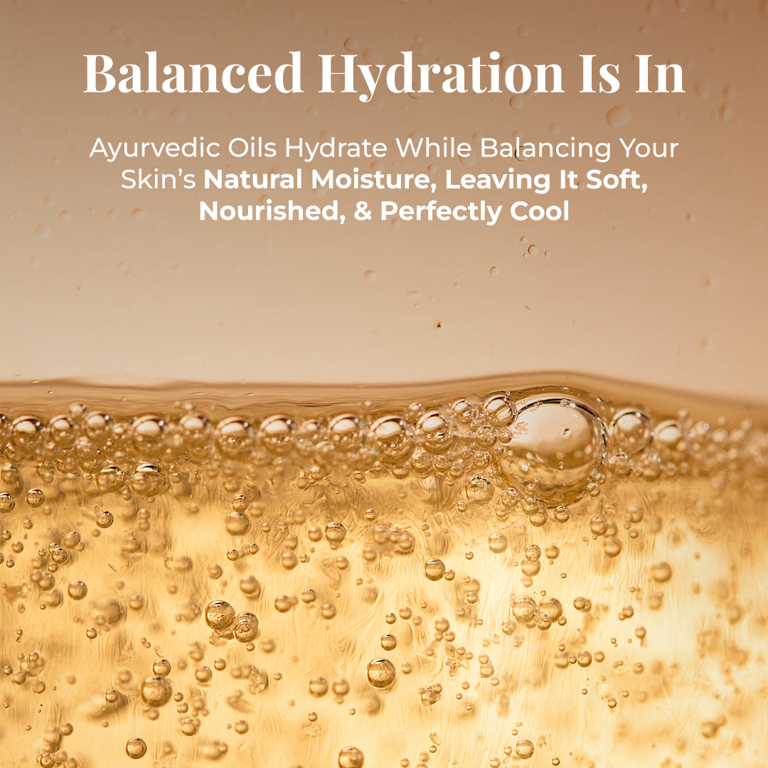 Close-up abstract image of golden-hued liquid with numerous small and large bubbles, suggesting a rich, bubbly texture. Tagline: Balanced Hydration Is In. Text describes the benefits of JiViSa Seven Spice Ayurvedic soap ingredients: Ayurvedic Oils Hydrate While Balancing Your Skin’s Natural Moisture, Leaving It Soft, Nourished, & Perfectly Cool.