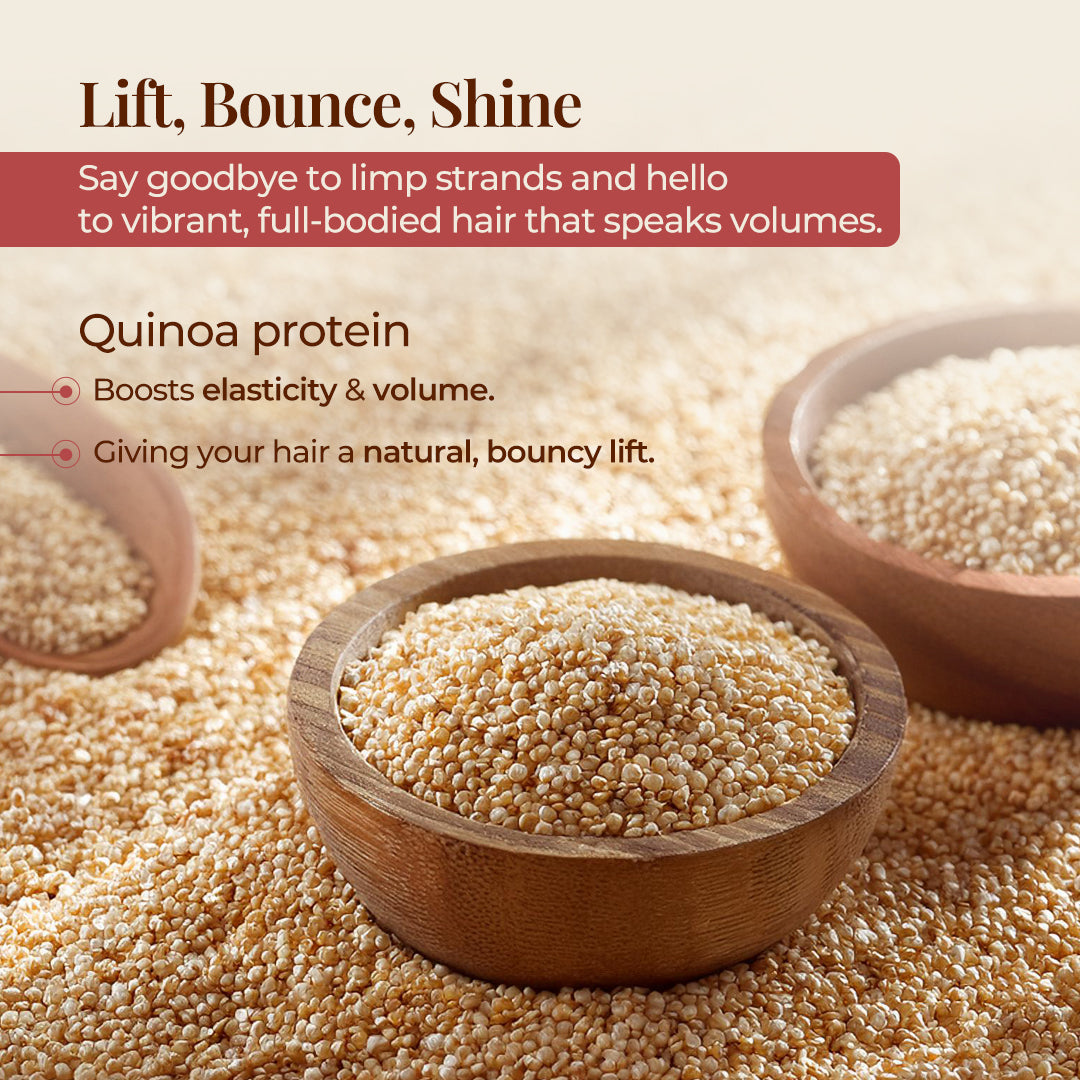 The image features several wooden bowls filled with quinoa seeds, set against a background of loose quinoa seeds with the tagline "Lift, Bounce, Shine" and the description Say goodbye to limp strands and hello to vibrant, full-bodied hair that speaks volumes. It highlights Quinoa protein and its benefits, stating that it Boosts elasticity & volume and is Giving your hair a natural, bouncy lift.