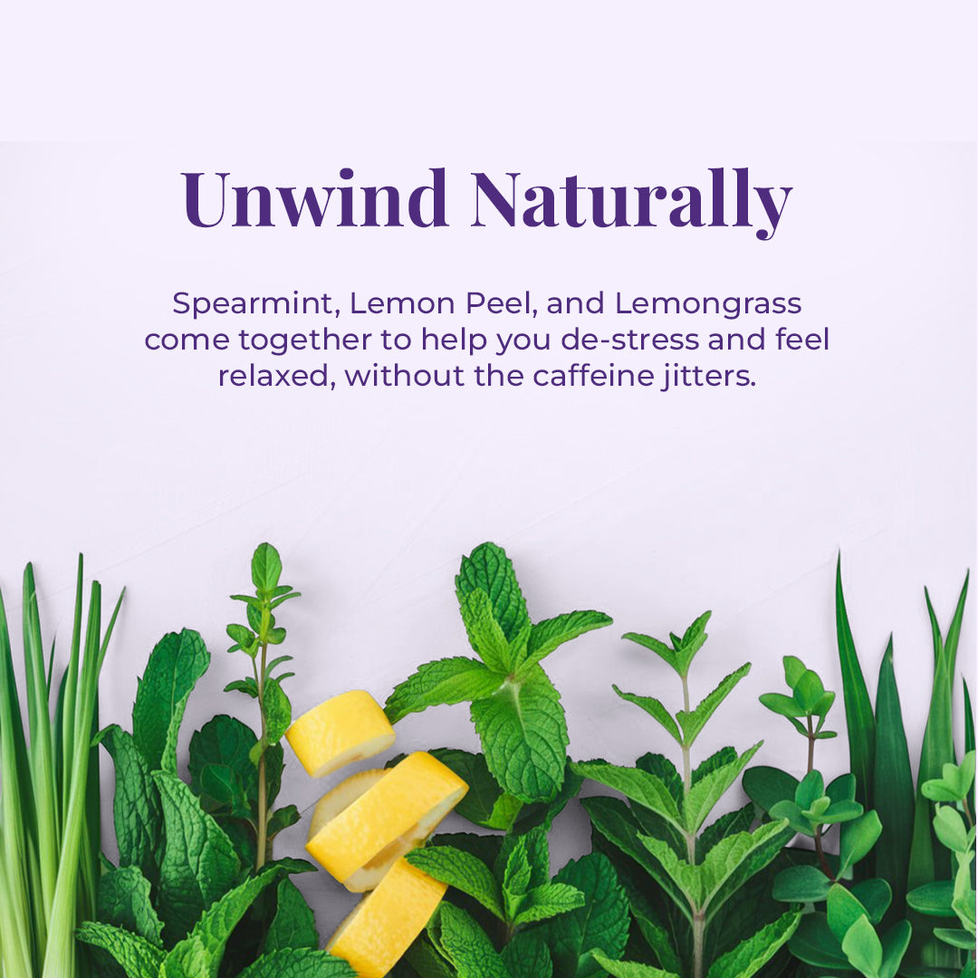 The tagline "Unwind Naturally" suggesting relaxation and a natural approach to calming down. The subsequent text clearly lists JiViSa -The Tranquility Blend ingredients – Spearmint, Lemon Peel, and Lemongrass come together to help you de-stress and feel relaxed, without the caffeine jitters. The arrangement of the fresh ingredients at the bottom reinforces this natural and calming theme. The vibrant greens and yellows evoke a sense of freshness and well-being