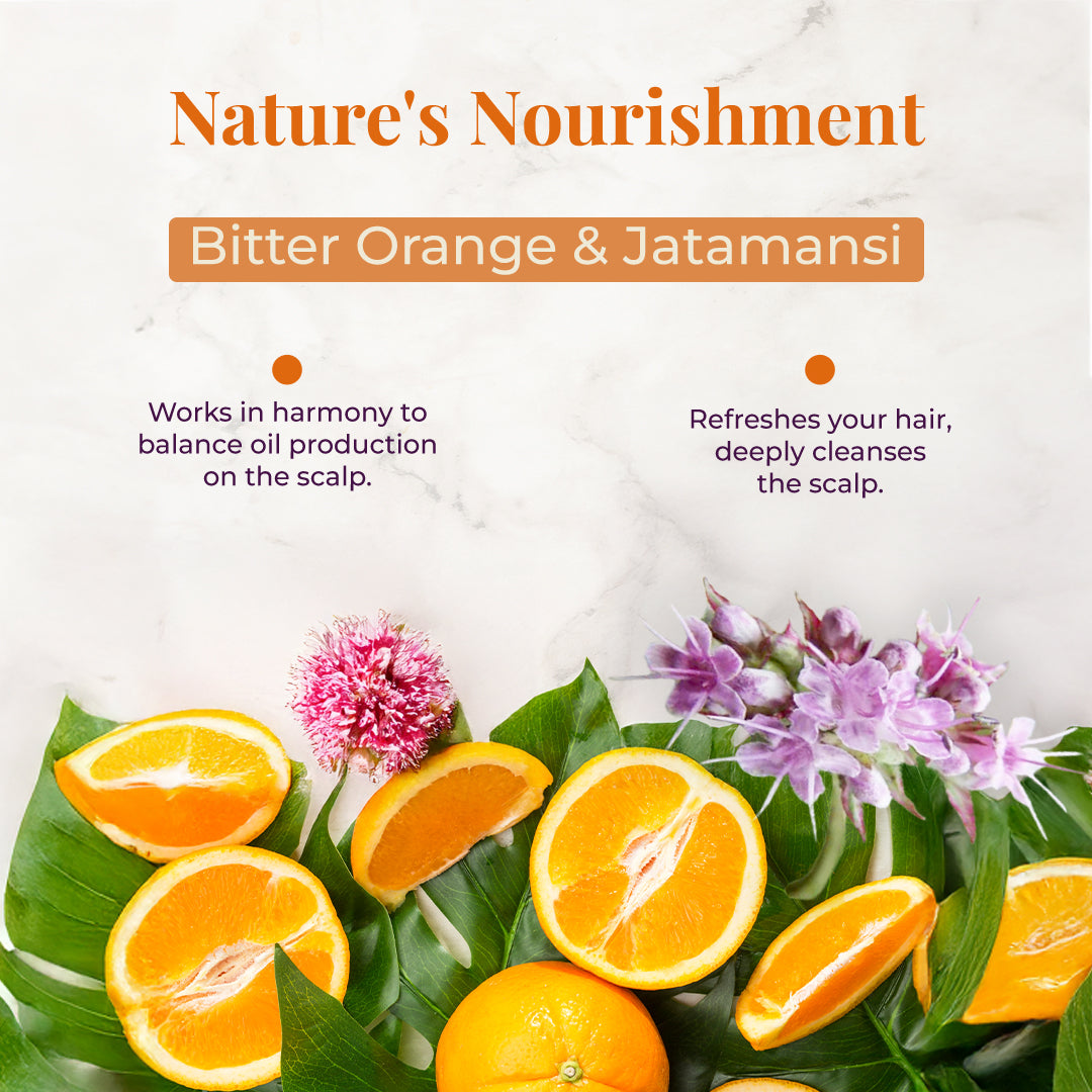 Bitter orange slices and jatamansi flowers displayed on leaves showing natural scalp cleansing ingredients used in JiViSa Tarang Bounce Hair Cleanser.