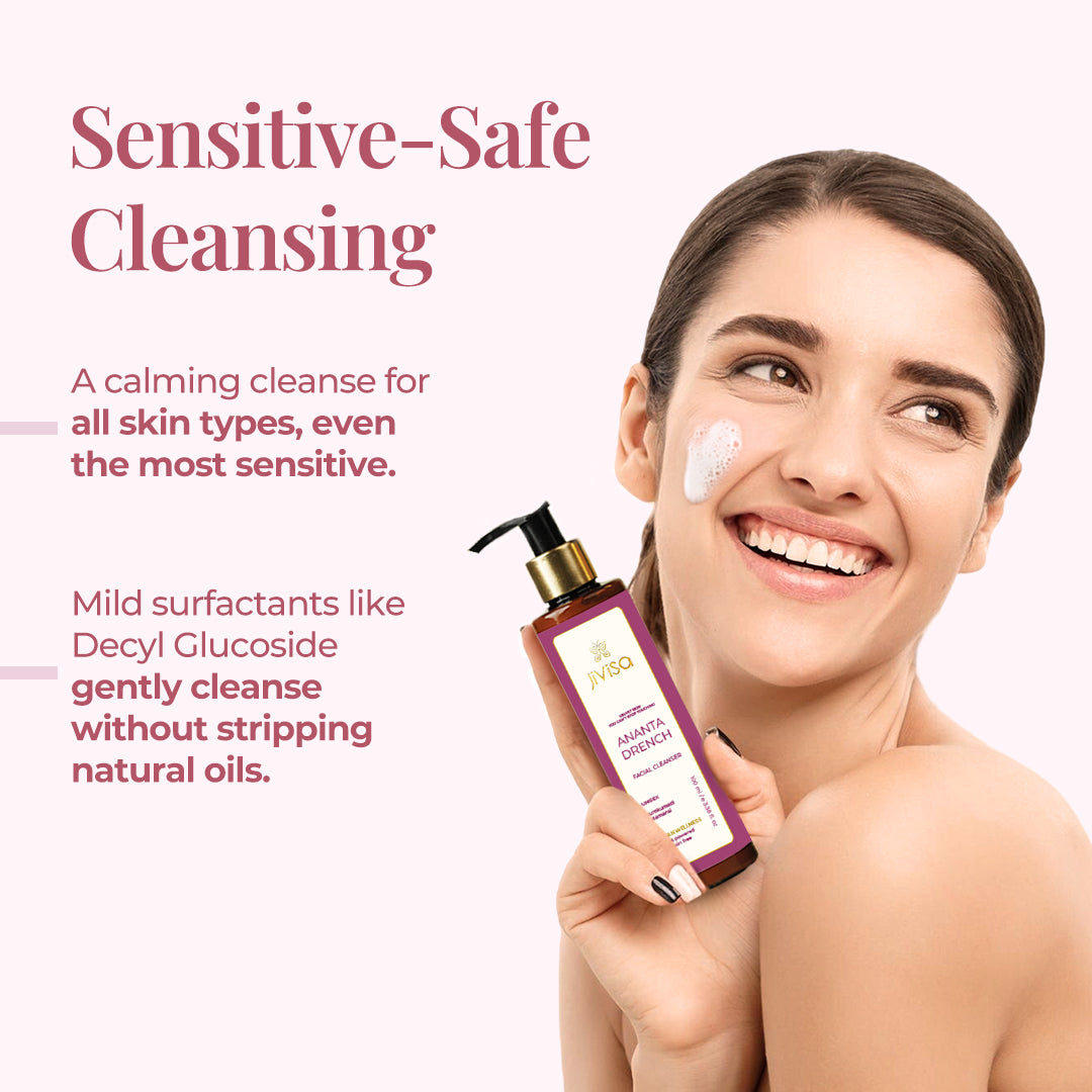 Smiling woman with face foam holds JiViSa Ananta Drench Facial Cleanser. Tagline reads: &