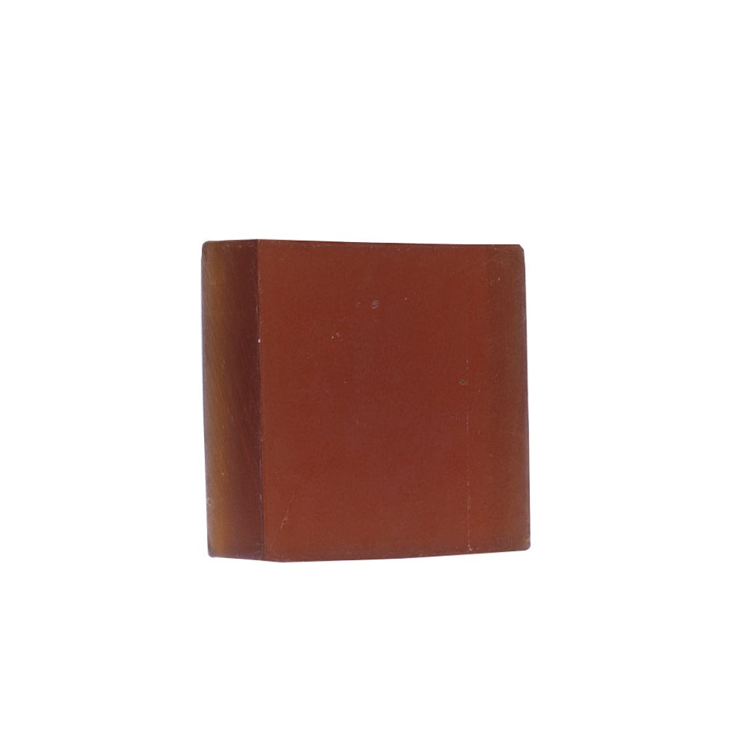 A deep brown JiViSa Arabic Oudh Handcrafted Ayurvedic Soap bar is placed against a white background.