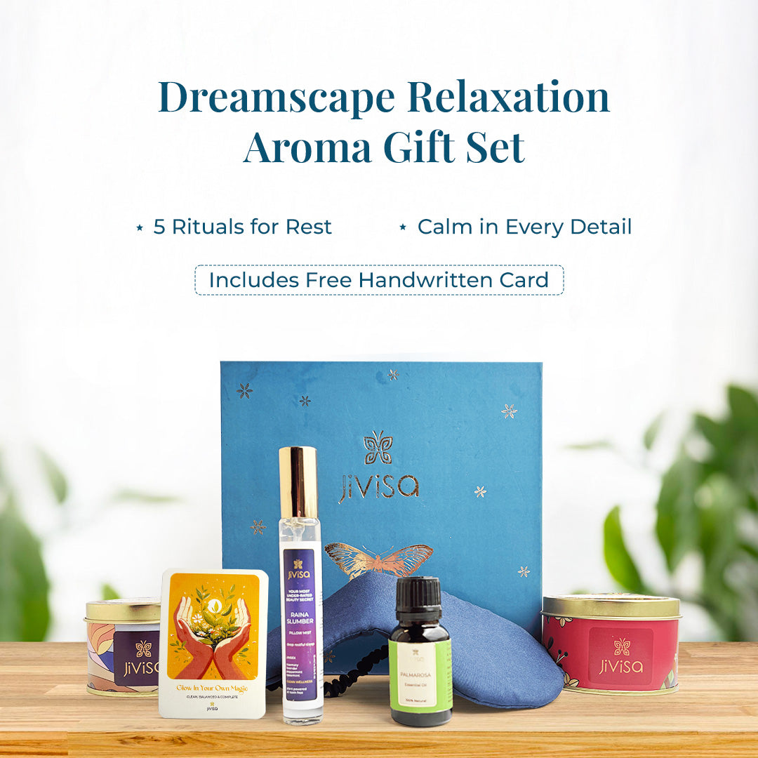 JiViSa Dreamscape Relaxation Aroma Gift Set paired with five beautifully arranged JiViSa self-care products in front: JiViSa Tranquility Blend Stress Relief Herbal Tea, the Royal Oudh Premium Soy Wax Candle, a bottle of Palmarosa Essential Oil, the soothing Raina Slumber Pillow Mist, an affirmation gift card and a soft blue eye mask. The text describes JiViSa Dreamscape Aroma Gift Set as the 5 Rituals for Rest and Calm in Every Detail, Includes Free Handwritten Card.