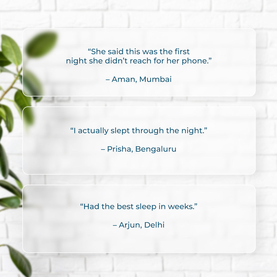 Text quotes on a white brick wall background with green leaves. Customer reviews for Dreamscape Relaxation Aroma Gift Set: “She said this was the first night she didn’t reach for her phone” – Aman, Mumbai; “I actually slept through the night” – Prisha, Bengaluru; “Had the best sleep in weeks” – Arjun, Delhi.