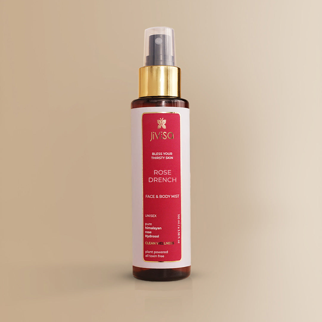 JiViSa Rose Drench face and body mist 100ML bottle with gold spray cap on a neutral beige background.