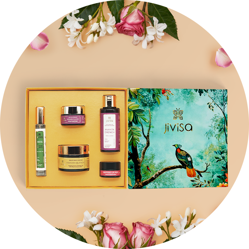 Jivisa skincare product set with decorative packaging on a floral background