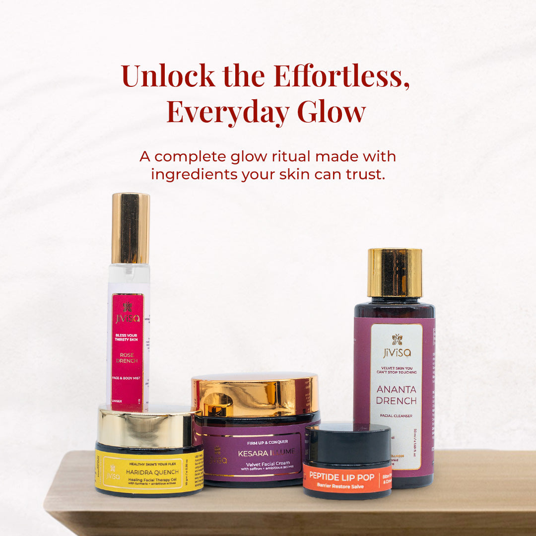 Heading reads: "Unlock the Effortless, Everyday Glow – A complete glow ritual made with ingredients your skin can trust." JiViSa Himalayan Glow Rituals for Her Gift Box includes Rose Breeze body mist, Ananta Drench facial cleanser, Kesara Lumiere night cream, Haridra Quench turmeric face gel, and Peptide Lip Pop barrier restore salve, all placed on a wooden tray against a soft white background.