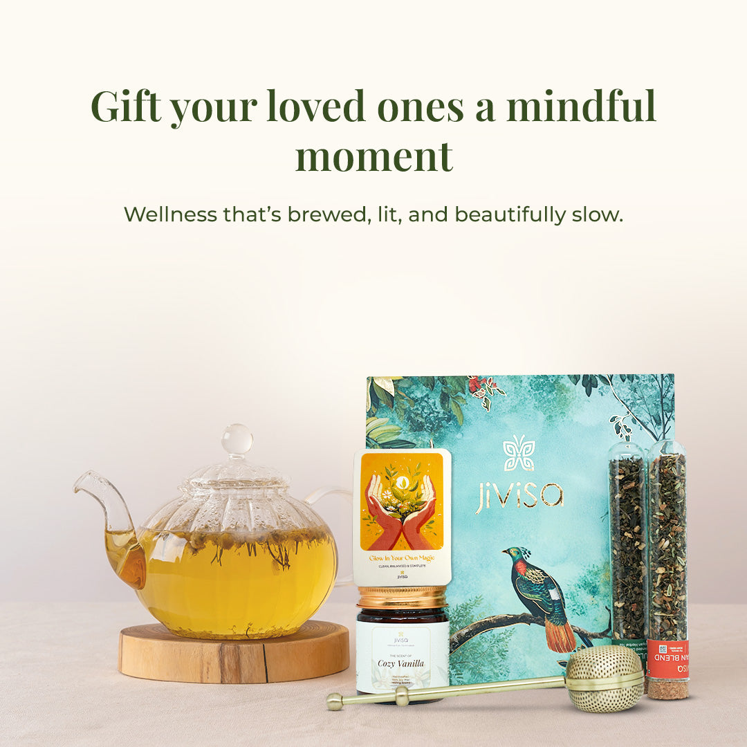 JiViSa Brew & Bliss Gift Set styled with a glass teapot, Cozy Vanilla candle, tea tube, handwritten card, and botanical gift box. Headline reads: “Gift your loved ones a mindful moment.” Subtext: “Wellness that’s brewed, lit, and beautifully slow.”