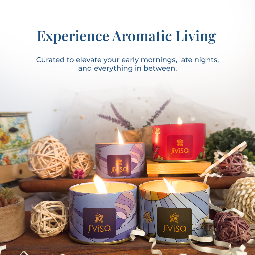 Lit JiViSa candles arranged decoratively with natural elements like wicker balls and potpourri. Headline reads: “Experience Aromatic Living.” Subtext: “Curated to elevate your early mornings, late nights, and everything in between.”