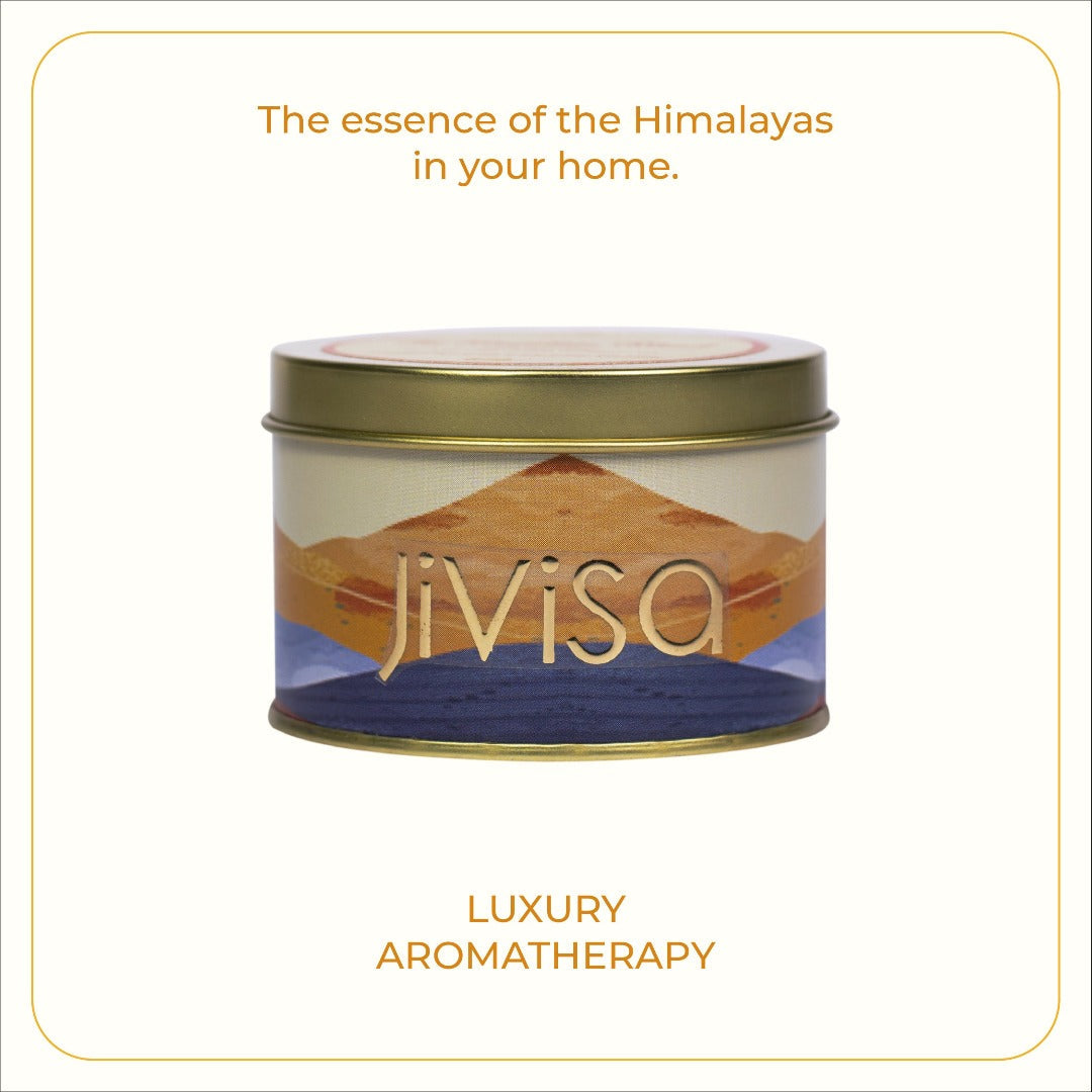 JiViSa Royal Oudh Metal Jar Candle with blue and yellowish-brown gradient design and gold lid, featuring the tagline "The essence of the Himalayas in your home – LUXURY AROMATHERAPY".