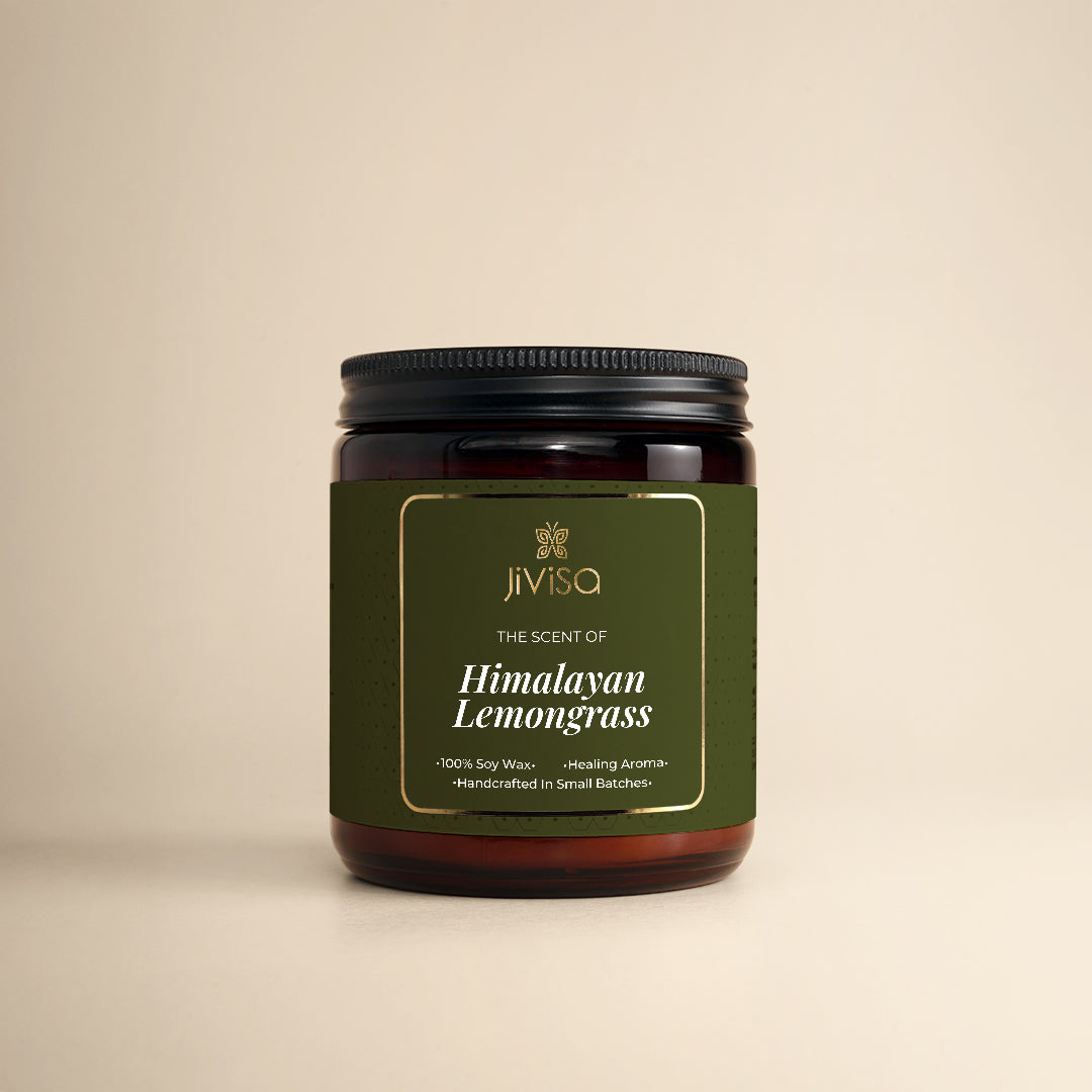 JiViSa Himalayan Lemongrass Handcrafted Soy Wax Candle 180gm in an amber glass jar with a Black tin and green label. The label reads: "JiViSa Wellness From The Himalayas, THE SCENT OF Himalayan Lemongrass, Handcrafted 100% Soy Wax Candle, Healing Aroma".