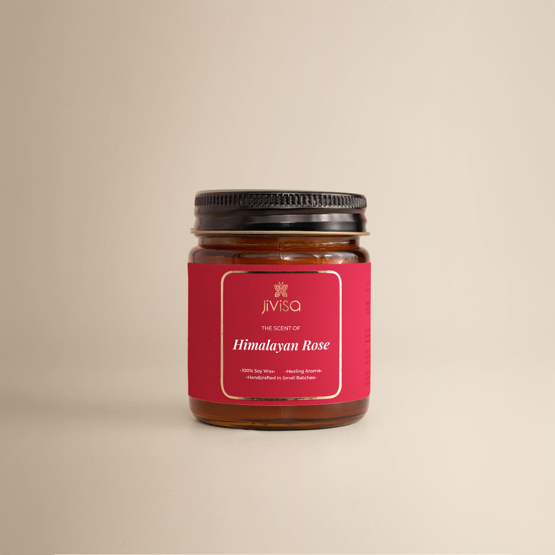 JiViSa Himalayan Lemongrass Handcrafted Soy Wax Candle 90gm in an amber glass jar with a Golden tin and white label. The label reads: "JiViSa Wellness From The Himalayas, THE SCENT OF Himalayan Rose, Handcrafted 100% Soy Wax Candle, LUXURY AROMATHERAPY".
