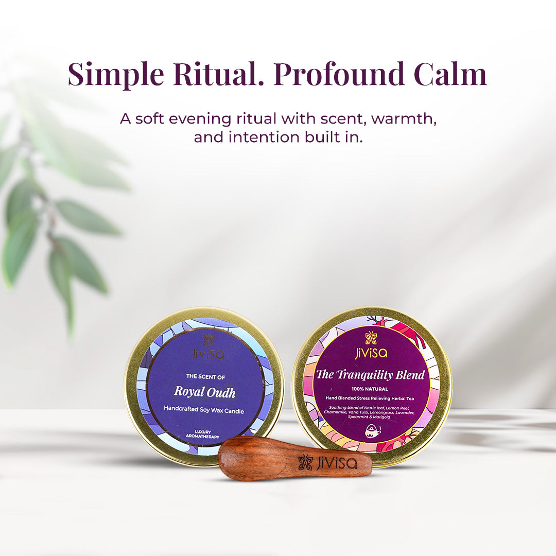 Tagline reads: "Simple Ritual. Profound Calm – A soft evening ritual with scent, warmth, and intention built in" followed by a clean, close-up display of JiViSa Royal Oudh candle and JiViSa Tranquility Blend tea tin with JiViSa wooden spoon in front. The image emphasizes the harmony between scent and sip in a minimalist setting with leafy accents.