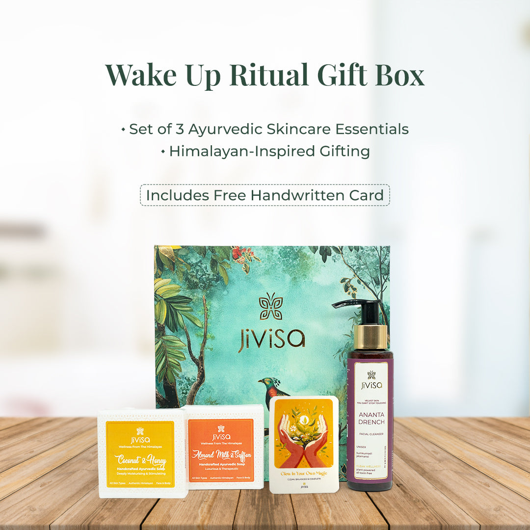 JiViSa Wake Up Ritual Gift Box featuring a beautifully illustrated botanical box with three Ayurvedic skincare essentials: Ananta Drench facial cleanser and two handcrafted soaps—Coconut & Honey and Almond Milk & Saffron. Includes a free handwritten card. Headline reads: “Wake Up Ritual Gift Box.” Subtext: “Set of 3 Ayurvedic Skincare Essentials • Himalayan-Inspired Gifting.”