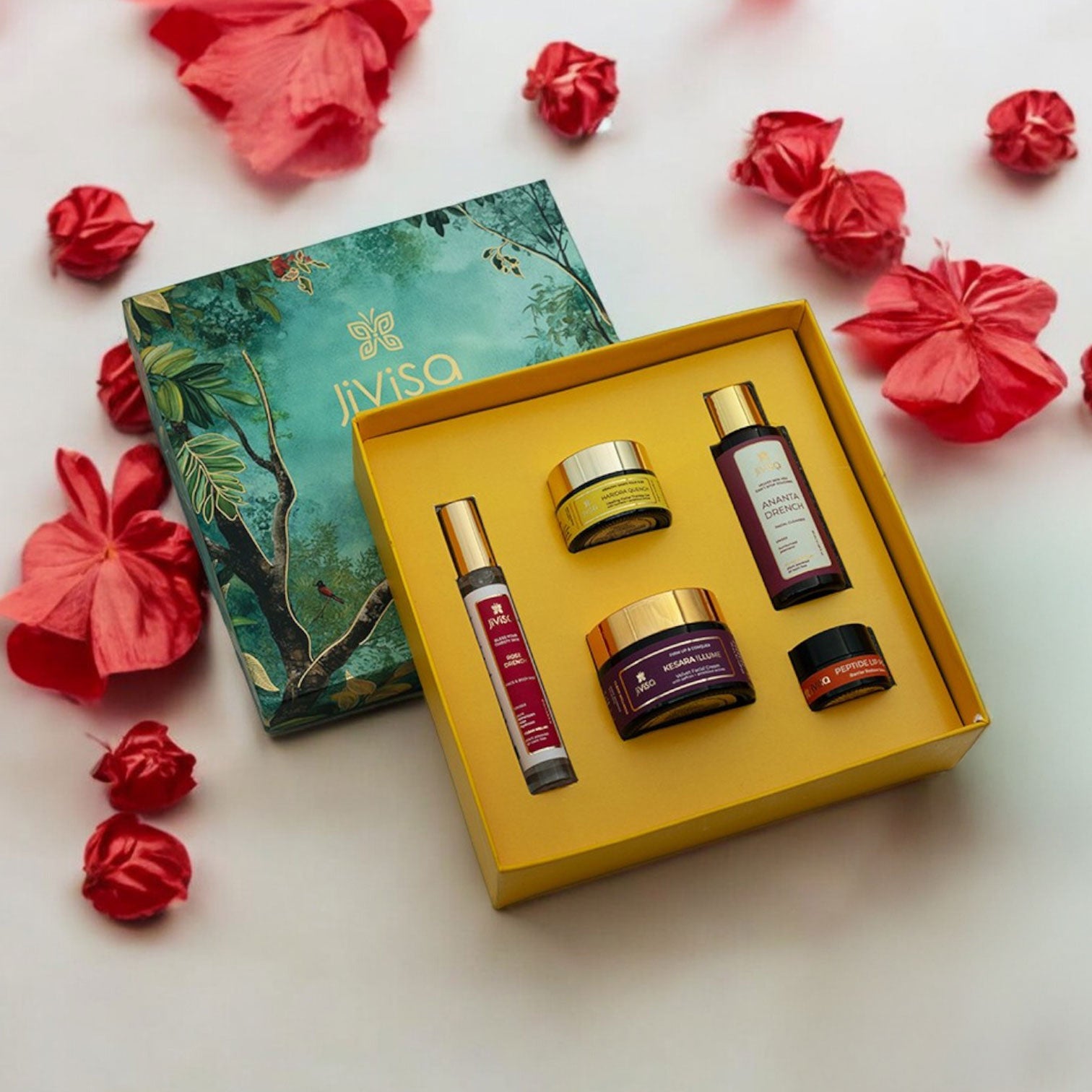 JiViSa-Himalayan Glow Ritual for Her Gift box is a beautifully curated collection of five premium wellness products designed to nourish and rejuvenate the skin. It includes the JiViSa-Ananta Drench Facial Cleanser, JiViSa-Rose Drench Face & Body Mist, JiViSa- Kesara Illume Velvet Facial Creme, JiViSa- Haridra Quench Healing Facial Therapy Gel and JiViSa-Peptide Lip Pop. Elegantly packed in a vibrant, nature-inspired gift box, this set makes a perfect gift for festive occasions or a luxurious treat for her.