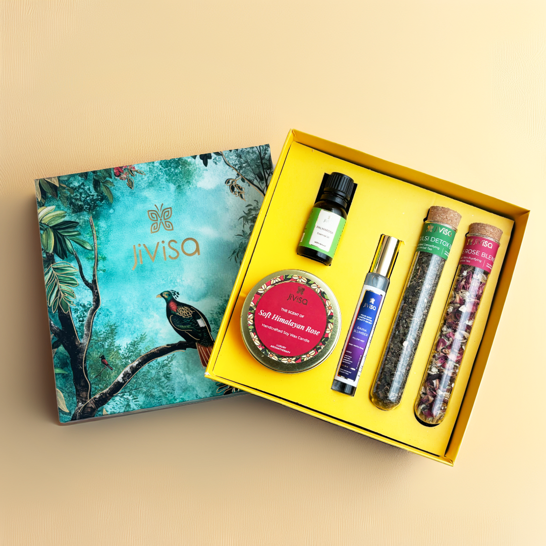 JiViSa Haze & Harmony Tea & Aroma Gift Box arranged with Soft Himalayan Rose candle, Tulsi Detox Blend and Rose blend herbal teas, Raina Slumber pillow mist, and diffuser oil in a luxury nature-inspired design box.