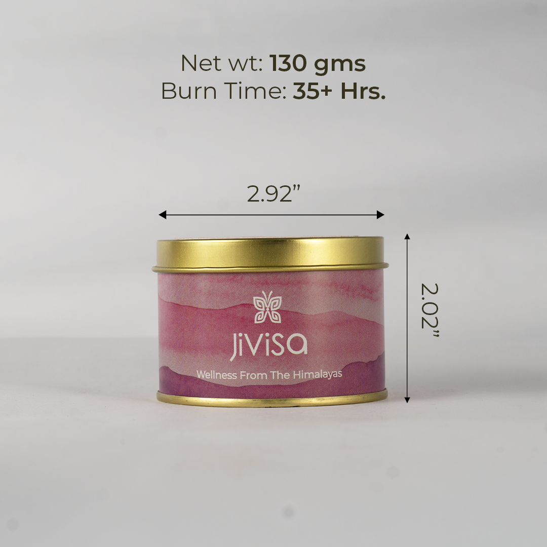 JiViSa Wellness From The Himalayas Cozy Vanilla Premium Soy Wax Candle in a gold tin with a pink and white swirl pattern. Text overlaid on the image indicates its dimensions and burn time: Net wt: 130 gms, Burn Time: 35+ Hrs, with arrows showing 2.92 width and 2.02 height.