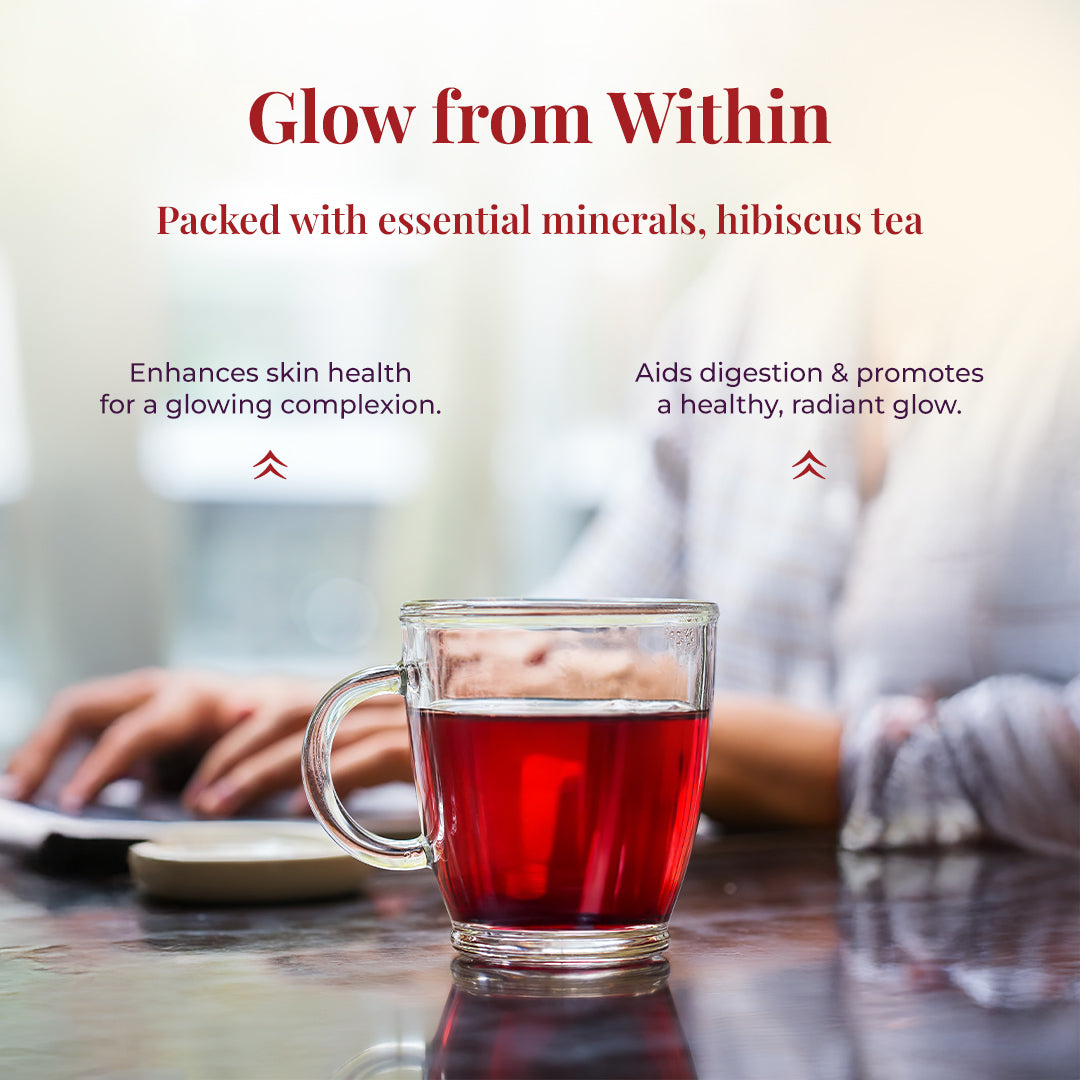 A glass cup of JiViSa-The Hibiscus Blend Herbal Tea centered with the tagline "Glow from within" with a title Packed with essential minerals, hibiscus tea. Below it the text highlights the benefits: Enhances skin health for a glowing complexion and aids digestion & promotes a healthy, radiant glow.