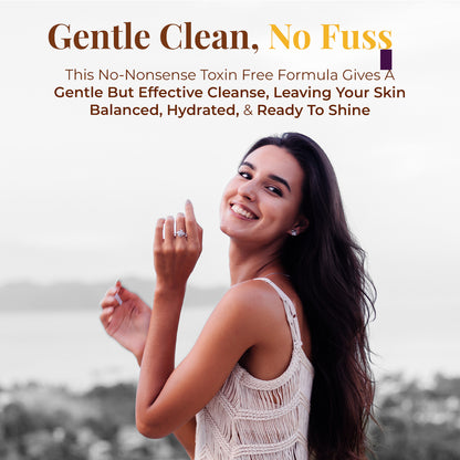 A young woman smiling broadly and looking over her shoulder with an outdoor, blurred background. Tagline: Gentle Clean, No Fuss. Text describes: This No-Nonsense Toxin Free Formula Gives a Gentle but Effective Cleanse, Leaving Your Skin Balanced, Hydrated, &amp; Ready to Shine.