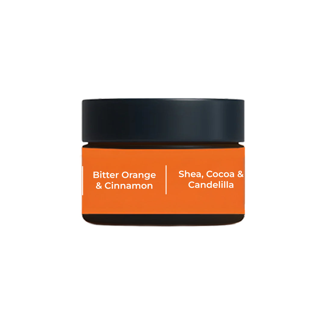 Peptide Lip Pop lip balm jar labeled Bitter Orange &amp; Cinnamon with shea, cocoa and candelilla wax ingredients.