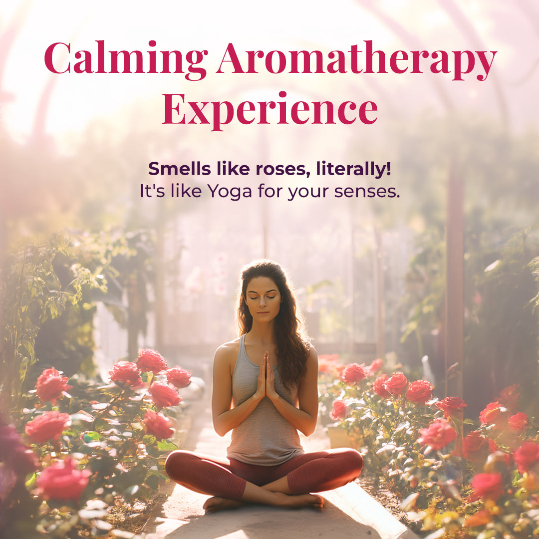 Woman meditating in a rose garden, symbolizing the calming aromatherapy experience and soothing rose fragrance of Rose Drench Face &amp; Body Mist.