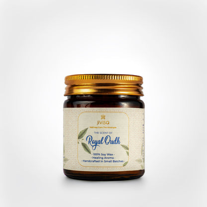 JiViSa Royal Oudh Handcrafted Soy Wax Candle 90gm in an amber glass jar with a Golden tin and white label.  The label reads: &quot;JiViSa Wellness From The Himalayas, THE SCENT OF Royal Oudh, 100% Soy Wax Candle, Healing Aroma, Handcrafted in Small Batches&quot;.