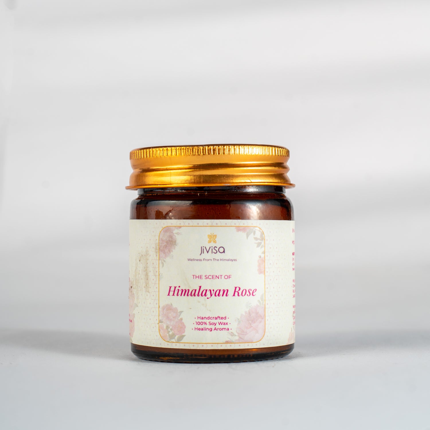 JiViSa Himalayan Lemongrass Handcrafted Soy Wax Candle 90gm in an amber glass jar with a Golden tin and white label.  The label reads: &quot;JiViSa Wellness From The Himalayas, THE SCENT OF Himalayan Rose, Handcrafted 100% Soy Wax Candle, LUXURY AROMATHERAPY&quot;.