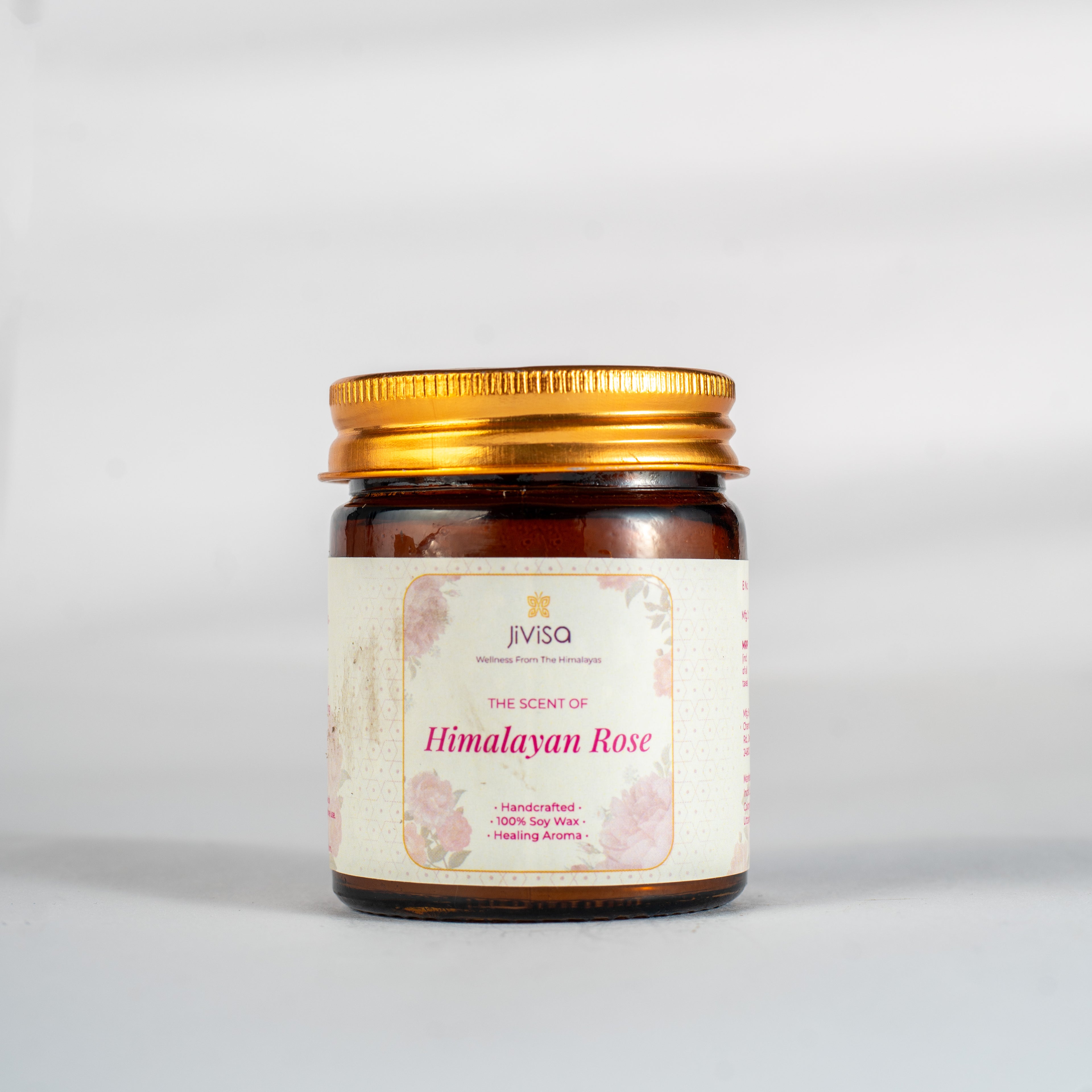 JiViSa Himalayan Lemongrass Handcrafted Soy Wax Candle 90gm in an amber glass jar with a Golden tin and white label.  The label reads: &quot;JiViSa Wellness From The Himalayas, THE SCENT OF Himalayan Rose, Handcrafted 100% Soy Wax Candle, LUXURY AROMATHERAPY&quot;.