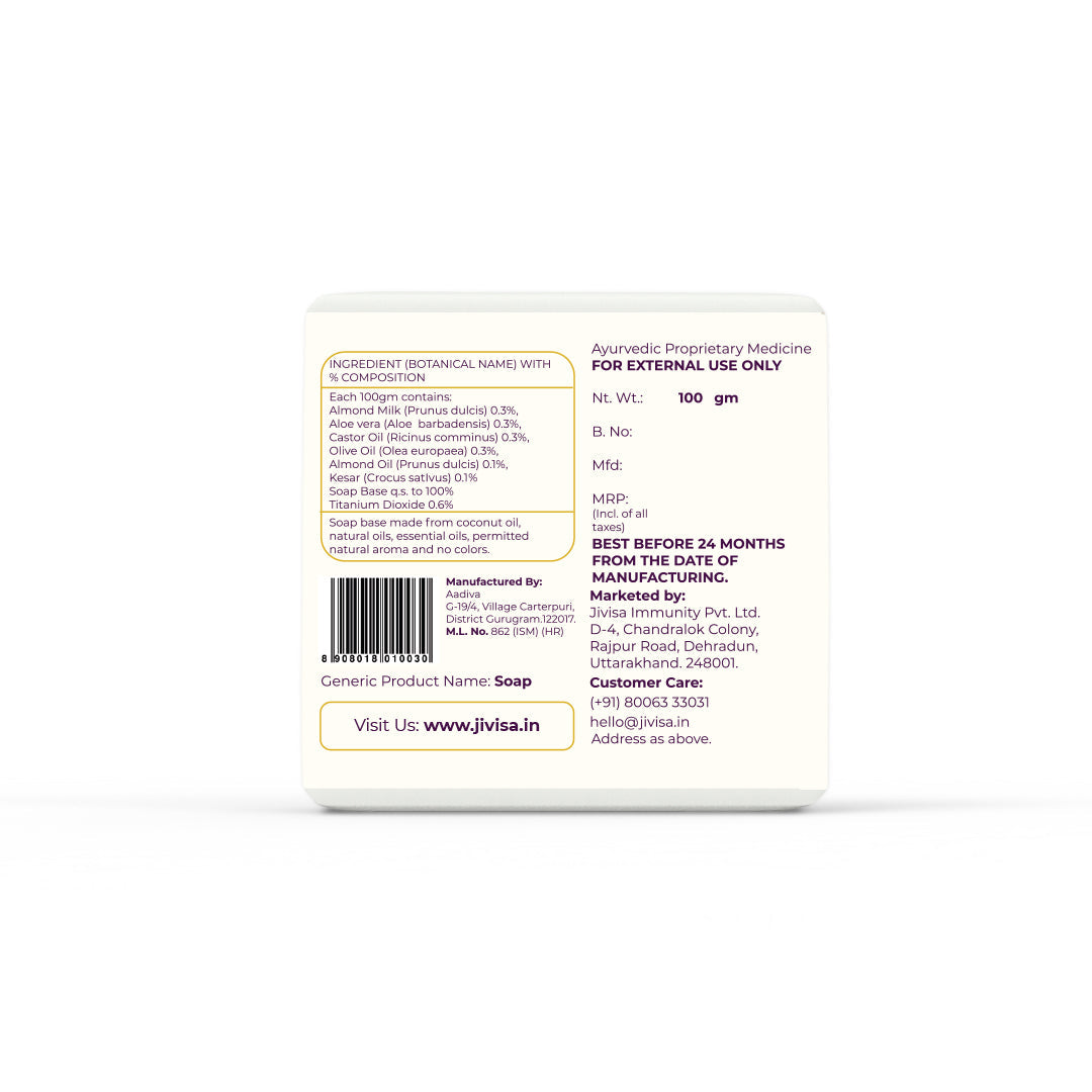 Back of JiViSa Almond Milk &amp; Saffron Ayurvedic Soap detailing ingredients, manufacturer, and customer care info. The ingredients list shows almond milk, aloe vera, olive oil, castor oil, and saffron. Emphasizes it is made from coconut oil, essential oils, with no added colors.

