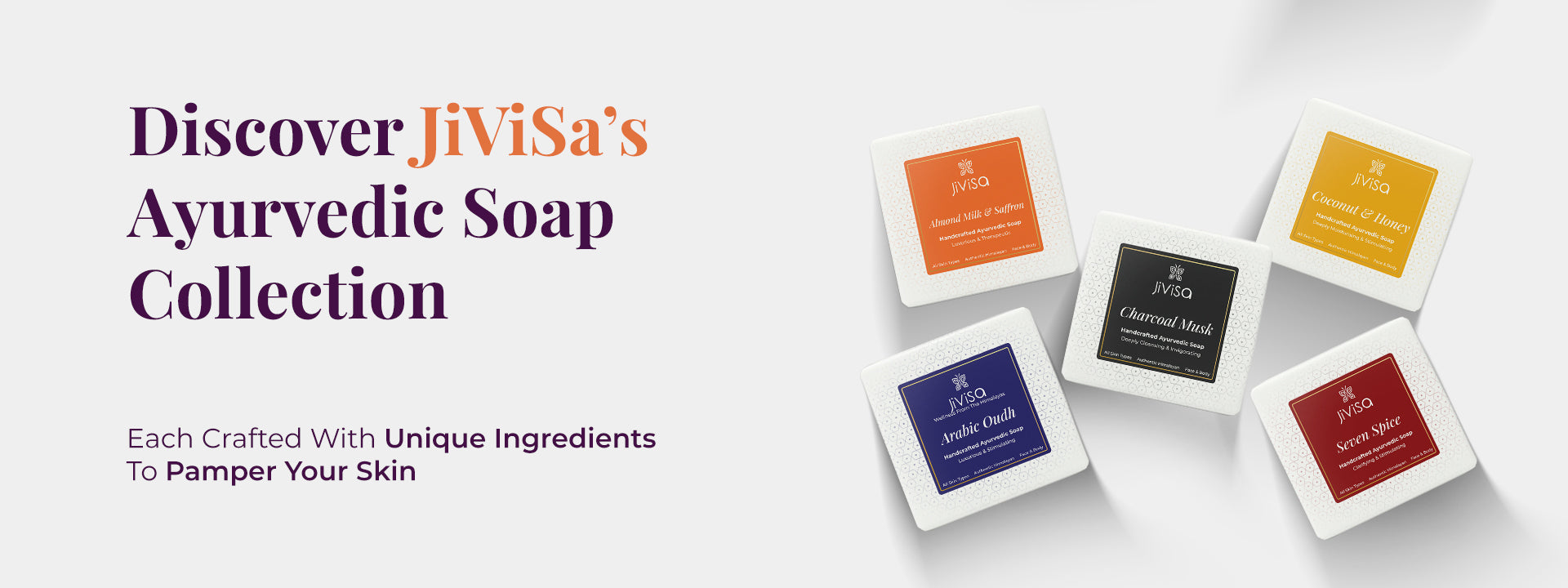 A flat lay image features five different JiViSa handmade ayurvedic soap variants: Almond Milk & Saffron, Arabic Oudh, Seven Spice, Charcoal Musk, and Coconut & Honey. The left side contains text reading “Discover JiViSa’s Ayurvedic Soap Collection” and “Each Crafted With Unique Ingredients To Pamper Your Skin.” The visual highlights product variety and ingredient-based formulation.