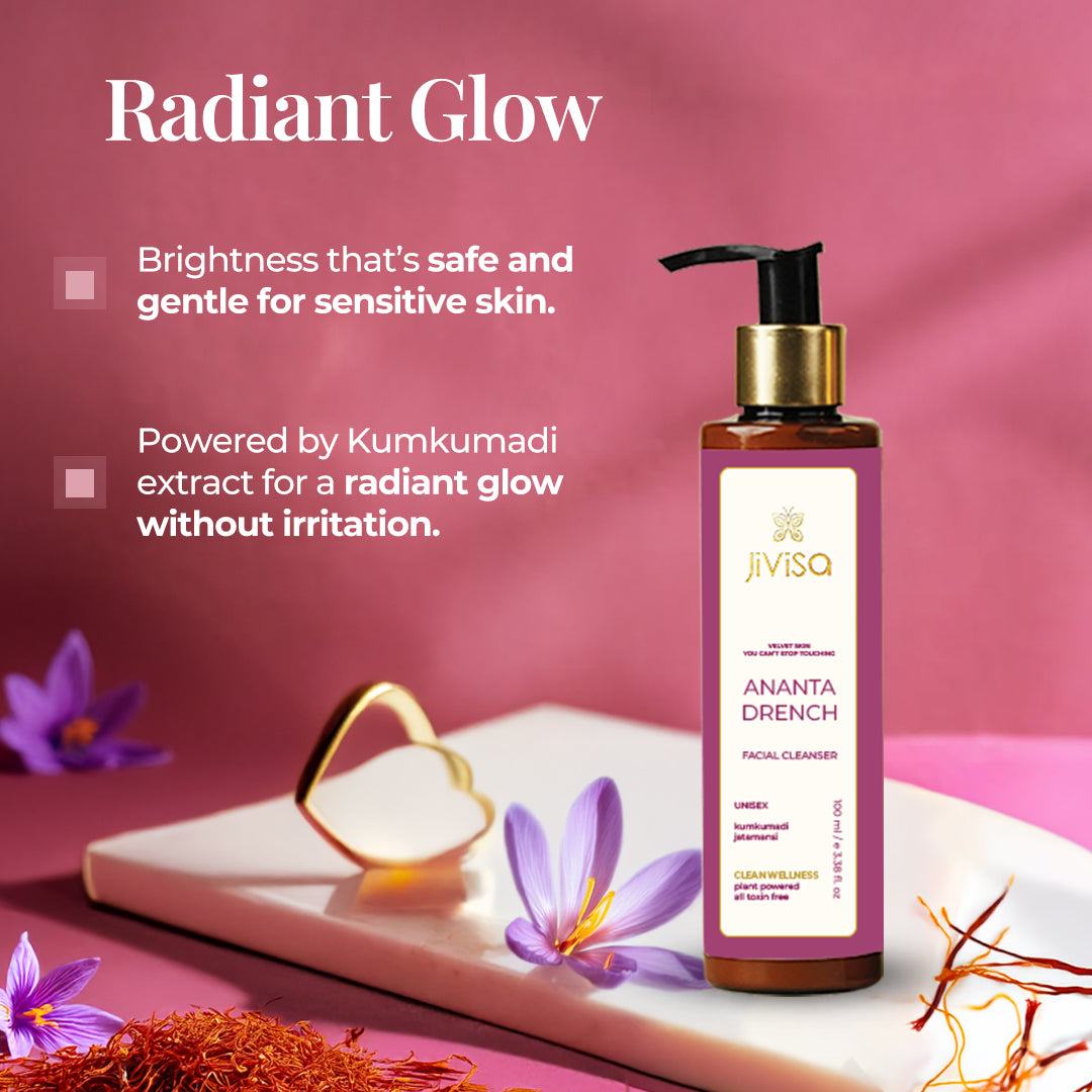 JiViSa Ananta Drench Facial Cleanser bottle on display with saffron strands and purple flowers. Tagline reads: &