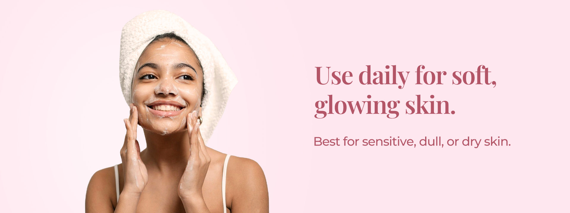 The image features a woman happily applying a JiVisa Ananta Drench facial cleanser, accompanied by the tagline "Use daily for soft, glowing skin." It highlights that the product is best for sensitive, dull, or dry skin, emphasizing daily use for visible results.