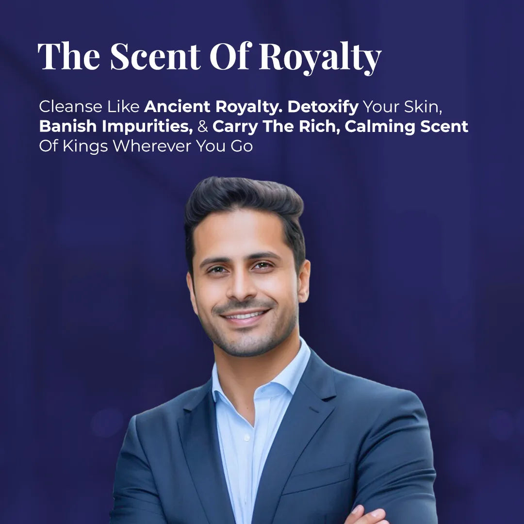 Smiling man in navy suit promoting JiViSa Arabic Oudh soap "The Scent of Royalty" for detoxifying and cleansing skin