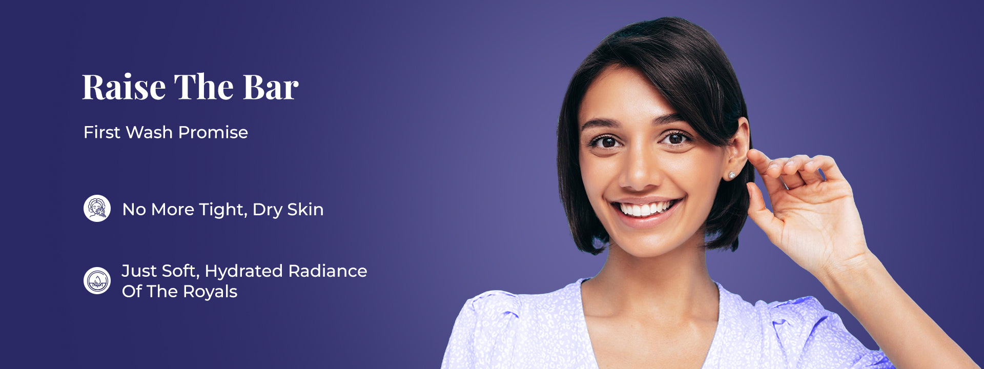 Tagline reads: “Raise The Bar”, followed by text 'First Wash Promise.' Two points are listed: “No More Tight, Dry Skin” and “Just Soft, Hydrated Radiance Of The Royals.” On the right, a smiling woman in a light blue top is shown against a purple background, suggesting satisfaction after use.