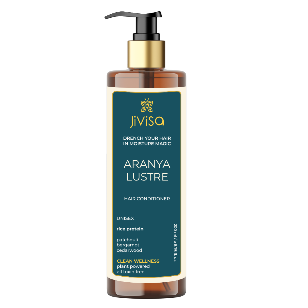 Front view of JiViSa Aranya Lustre Hair Conditioner bottle labeled with the product's name, highlighting key ingredients like rice protein, patchouli, bergamot, and cedarwood. The product promises to drench hair in moisture magic and is plant-powered and toxin-free.