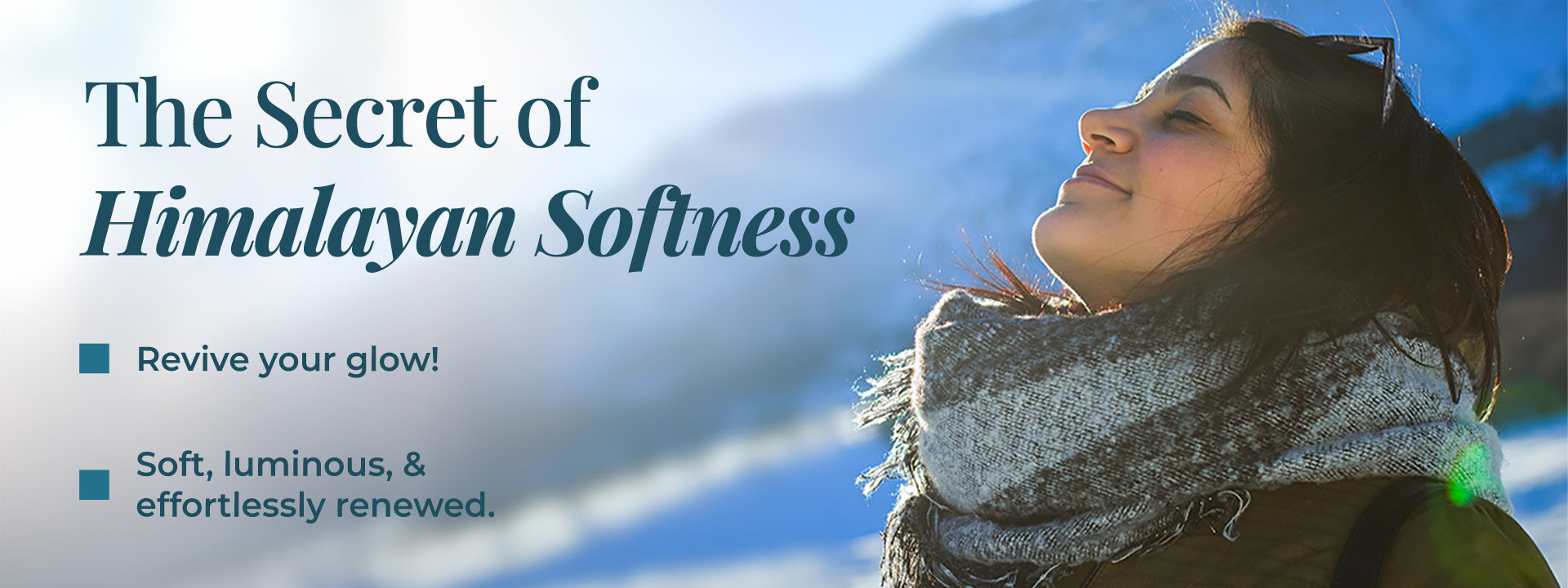 The image reflects freshness, purity, and nature-powered JiViSa Aranya Glaze Buttery Body Milk. A smiling woman enjoys the crisp mountain air, wrapped in a cozy scarf against a backdrop of snowy Himalayan peaks. The text says: “The Secret of Himalayan Softness” followed by bullet points: Revive your glow! and Soft, luminous, & effortlessly renewed. 