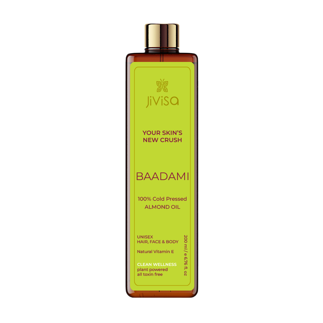 Image of JiViSa Badami 100% Cold Pressed Almond Oil, a 200 ml amber bottle with a gold cap. The front label reads 'Badami 100% Cold Pressed Almond Oil' and highlights its use for hair, face, and body. The label promotes its natural Vitamin E content and clean wellness attributes, being plant-powered and toxin-free.