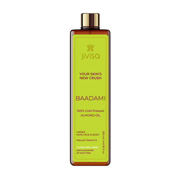 Image of JiViSa Badami 100% Cold Pressed Almond Oil, a 200 ml amber bottle with a gold cap. The front label reads 'Badami 100% Cold Pressed Almond Oil' and highlights its use for hair, face, and body. The label promotes its natural Vitamin E content and clean wellness attributes, being plant-powered and toxin-free.