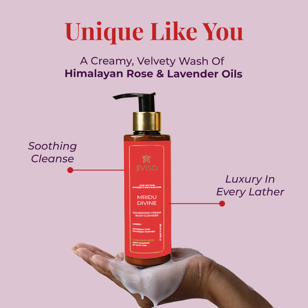 Image featuring a hand hold JiViSa Mridu Divine Body Cleanser describes as a Creamy, Velvety wash of Himalayan Rose &amp; Lavender Oils. Tagline reads "Unique Like You". The text highlights two features of JiViSa Mridu Divine Body Cleanser as Soothing Cleanse and Luxury in every lather.