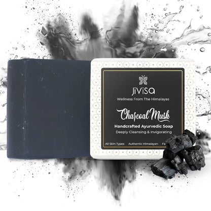 JiViSa Charcoal Musk Ayurvedic soap bar with black soap smoke effect and charcoal pieces on white background