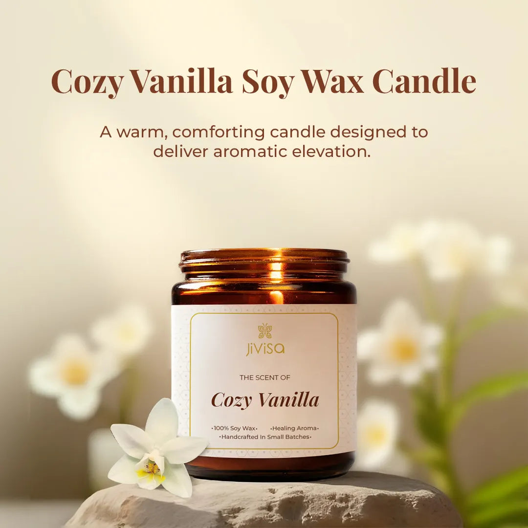 JiViSa Cozy Vanilla Soy Wax Candle styled with white flowers, a warm, comforting aromatherapy candle