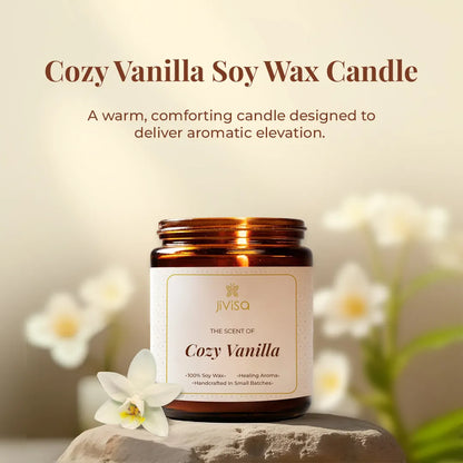 JiViSa Cozy Vanilla Soy Wax Candle styled with white flowers, a warm, comforting aromatherapy candle