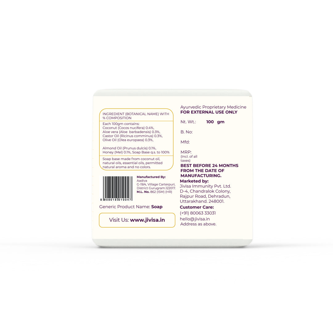 Back view of JiViSa Coconut &amp; Honey Ayurvedic Handmade Soap packaging showing the full label. The ingredient section lists: Coconut Oil (0.4%), Aloe Vera (0.3%), Castor Oil (0.3%), Olive Oil (0.3%), Almond Oil (0.1%), and Honey (0.1%). The soap base is made from coconut oil, essential oils, permitted natural aroma, and contains no added colors. It is marked &quot;For External Use Only&quot; and features a barcode along with the AYUSH license number (ML No. 82/ISM). 