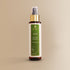 JiViSa Vetiver Drench face and body mist bottle on a beige background