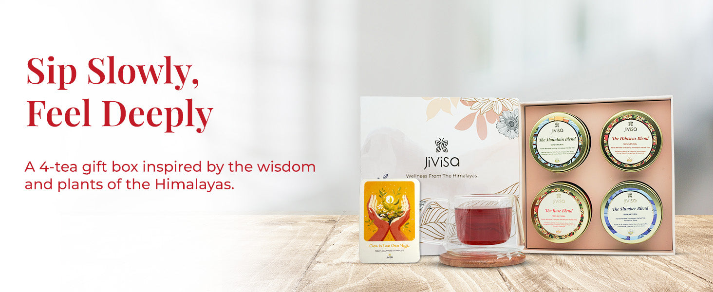 Image features an open JiViSa Himalayan Discovery Tea Gift Box with four herbal tea blends: The Mountain Blend, The Hibiscus Blend, The Rose Blend, and The Slumber Blend, along with a glass cup of tea and an illustrated card. Tagline reads: "Sip Slowly, Feel Deeply." Supporting text: A 4-tea gift box inspired by the wisdom and plants of the Himalayas. Box design includes floral elements and the label reads: JiViSa – Wellness From The Himalayas.