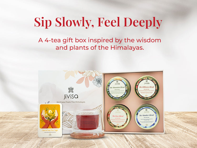 Image features an open JiViSa Himalayan Discovery Tea Gift Box with four herbal tea blends: The Mountain Blend, The Hibiscus Blend, The Rose Blend, and The Slumber Blend, along with a glass cup of tea and an illustrated card. Tagline reads: "Sip Slowly, Feel Deeply." Supporting text: A 4-tea gift box inspired by the wisdom and plants of the Himalayas. Box design includes floral elements and the label reads: JiViSa – Wellness From The Himalayas.
