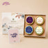 JiViSa Sibling Shoutout Rakhi gift box with 4 tins - Soft Lavender, Royal Oudh candles and Hibiscus, Mountain Blend teas  beside I&