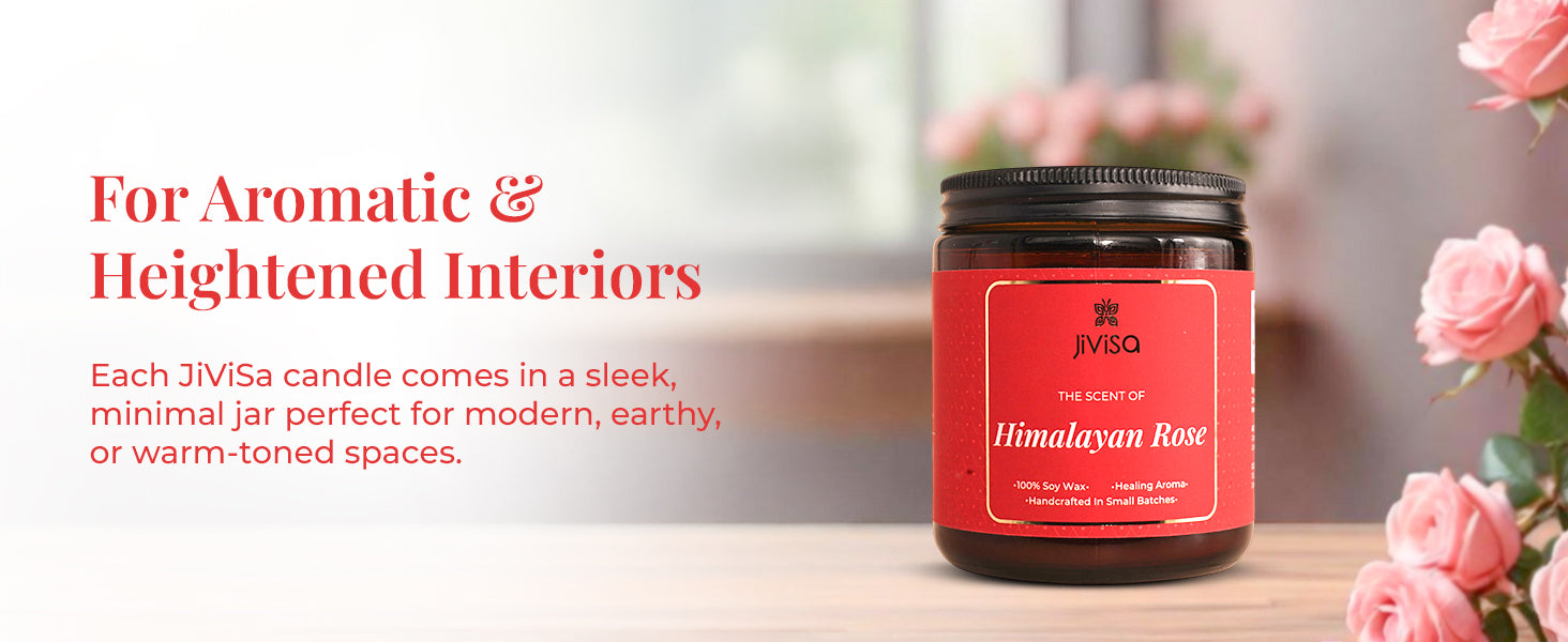 JiViSa Himalayan Rose Soy Wax Candle on a wooden table with soft-focus pink roses in the background. Tagline at the top reads: “For Aromatic & Heightened Interiors.” Body text reads: “Each JiViSa candle comes in a sleek, minimal jar perfect for modern, earthy, or warm-toned spaces.” Candle label reads: “JiViSa – The Scent of Himalayan Rose – 100% Soy Wax • Healing Aroma • Handcrafted in Small Batches.”